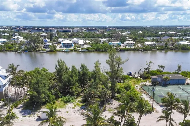 an aerial view of city and lake