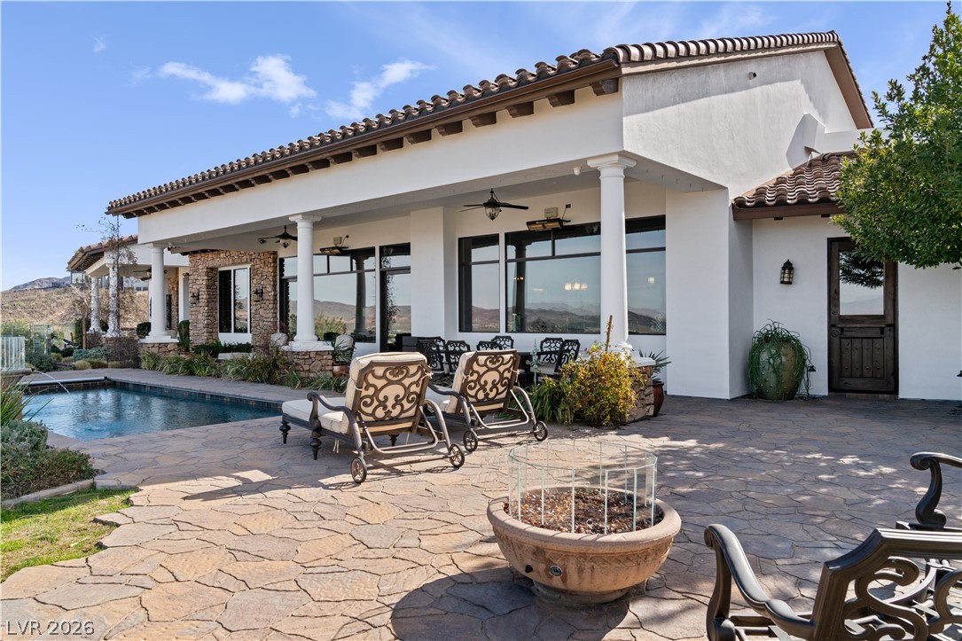 1123 Christian Road Henderson, NV 89002 - Photo 55 of 94 An inviting outdoor living space features a sparkling pool and a covered patio for ultimate relaxation.