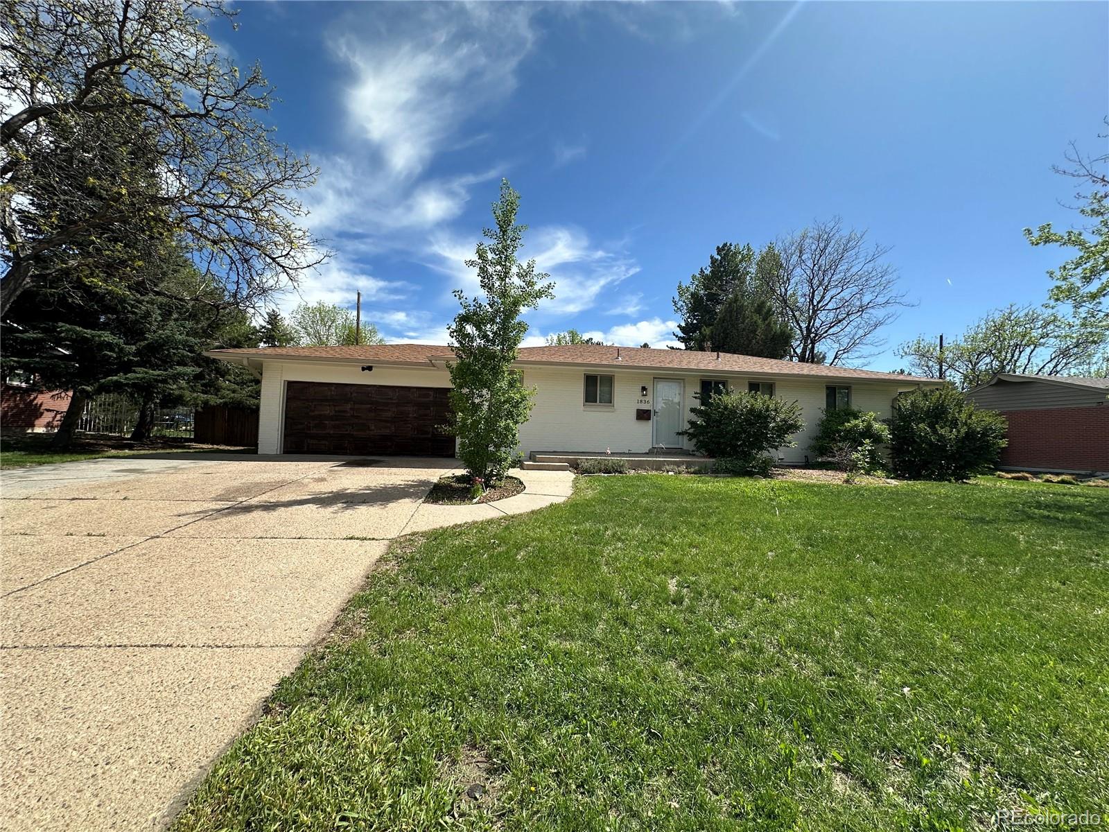 1836 East Mineral Avenue Centennial, CO 80122 - Photo 2 of 25 a front view of a house with a yard