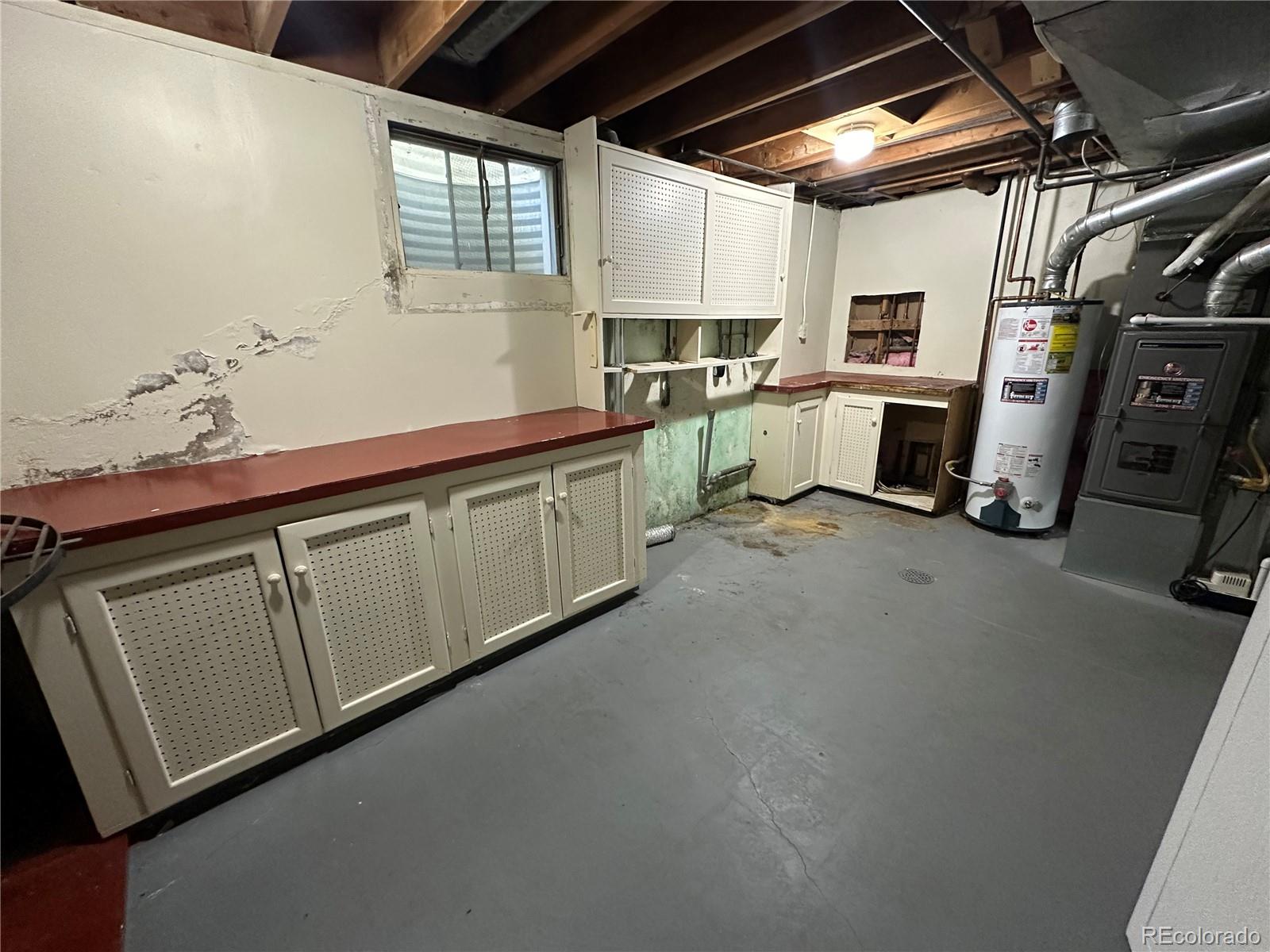 1836 East Mineral Avenue Centennial, CO 80122 - Photo 22 of 25 a kitchen with white cabinets and white appliances