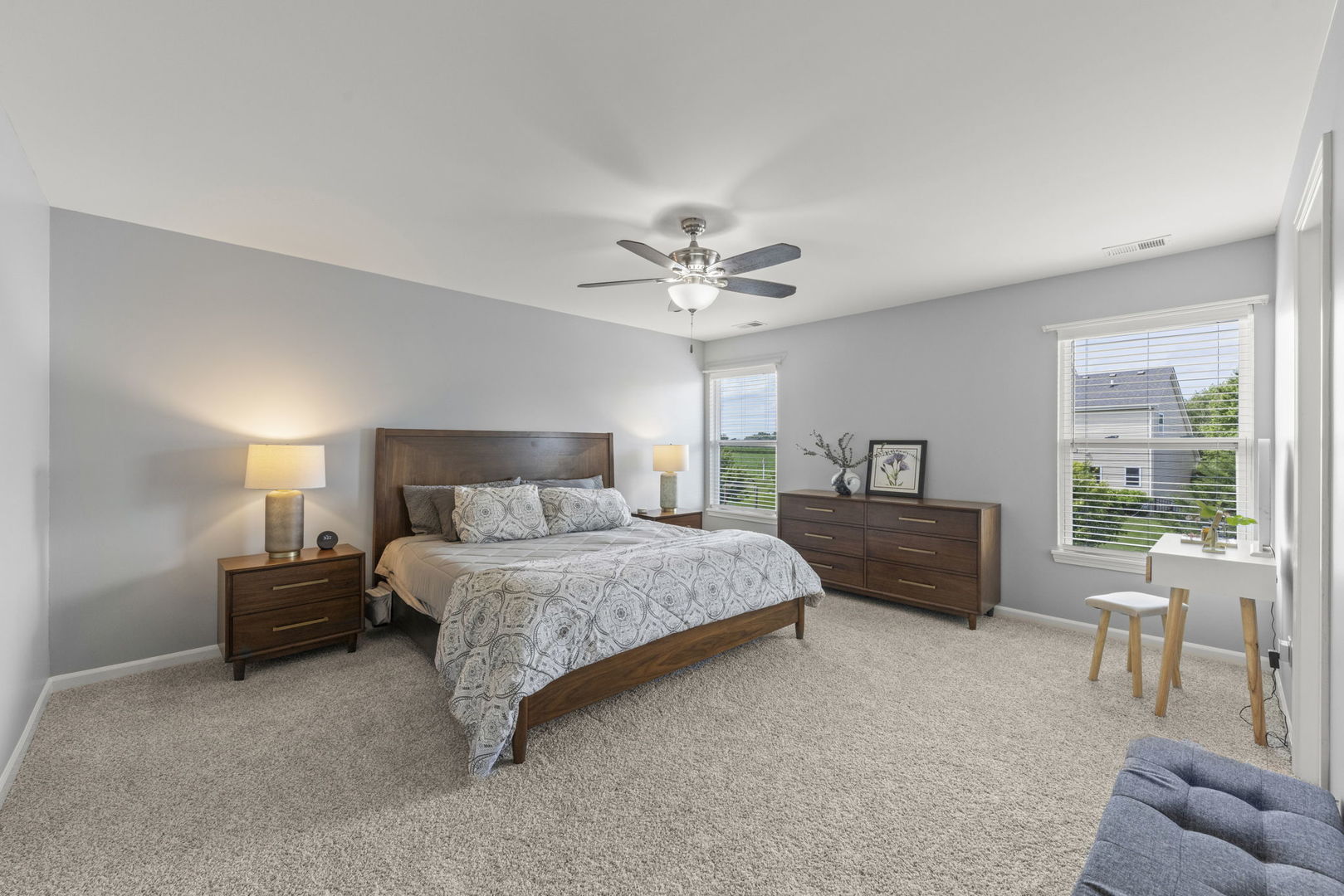 40W210 Palmer Road Geneva, IL 60134 - Photo 15 of 28 a spacious bedroom with a bed and a couch