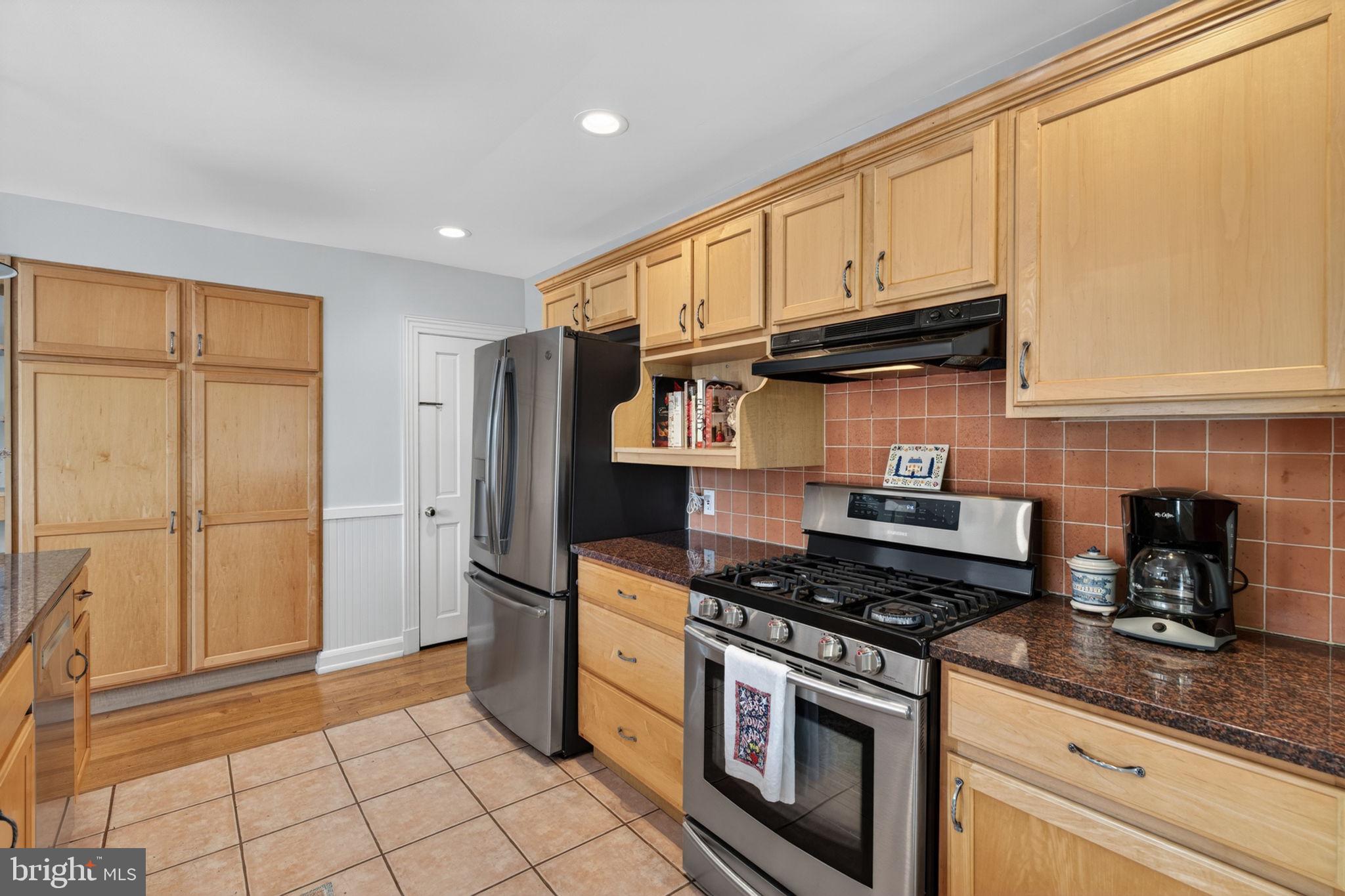 158 Hopkins Road Baltimore, MD 21212 - Photo 22 of 68 Modern kitchen with warm wood tones.