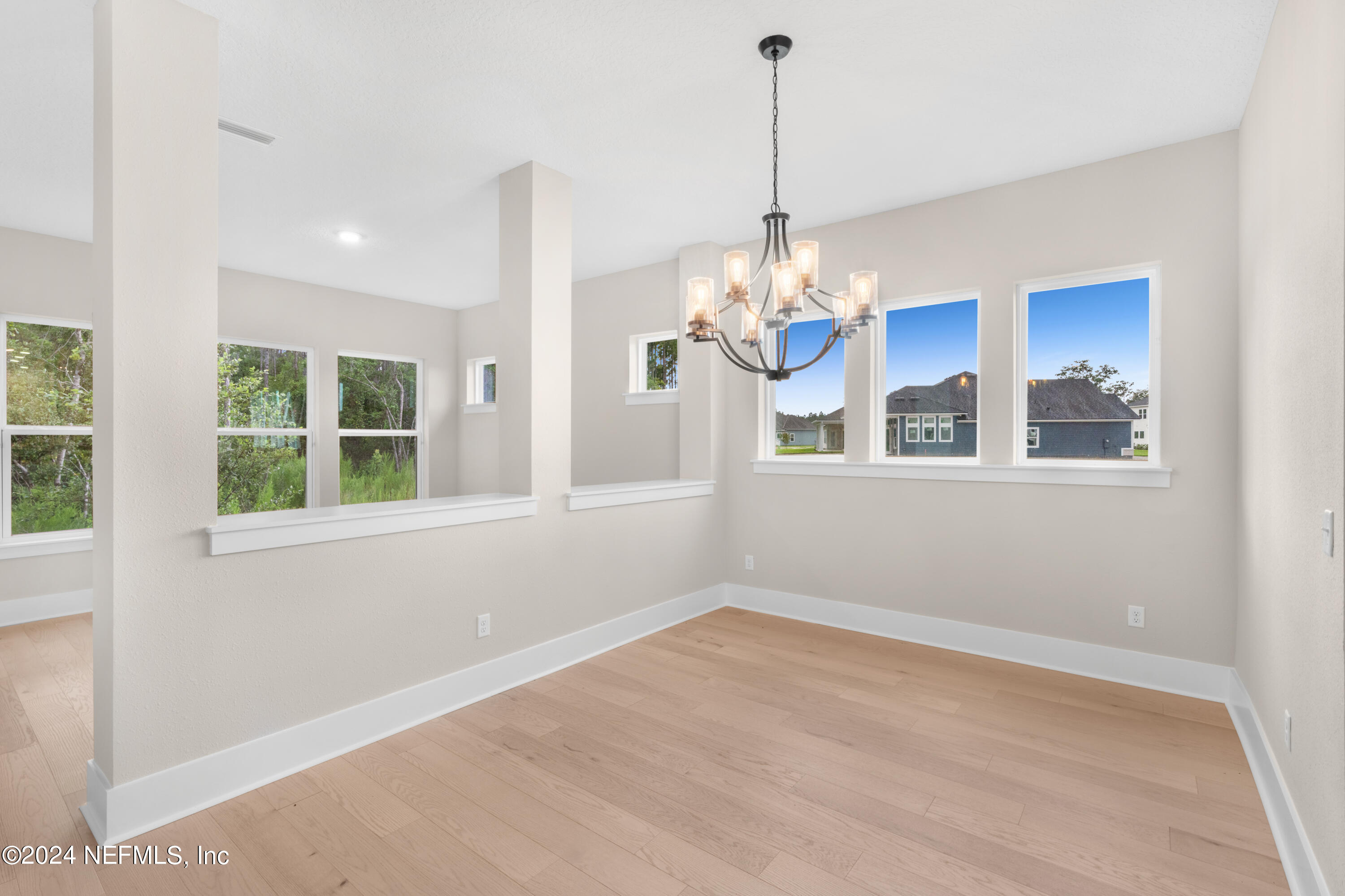 393 Canopy Forest Dr Street St. Augustine, FL 32092 - Photo 13 of 18 a view of a room with windows and chandelier