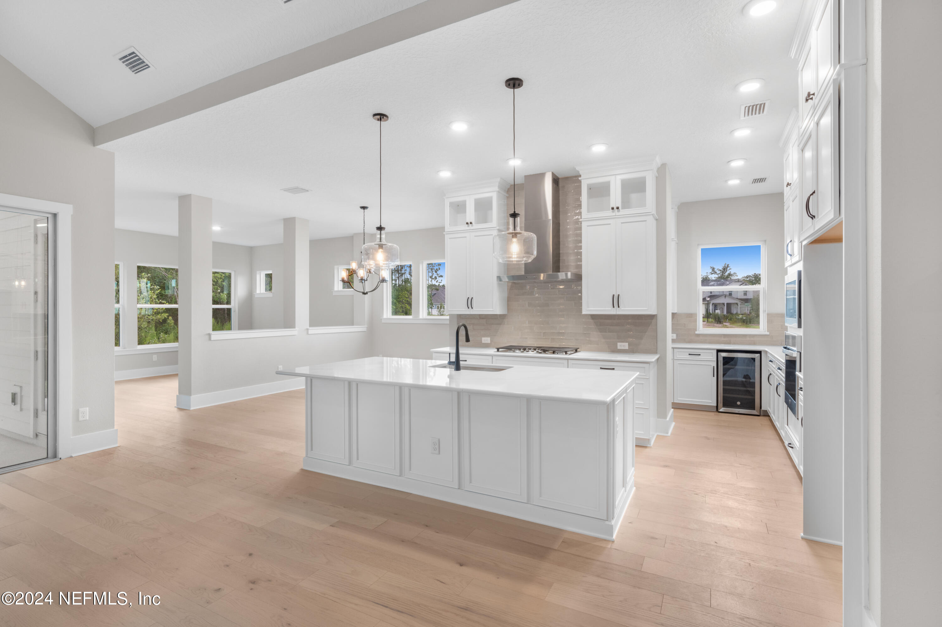393 Canopy Forest Dr Street St. Augustine, FL 32092 - Photo 4 of 18 a large kitchen with a large counter top a sink stainless steel appliances and cabinets