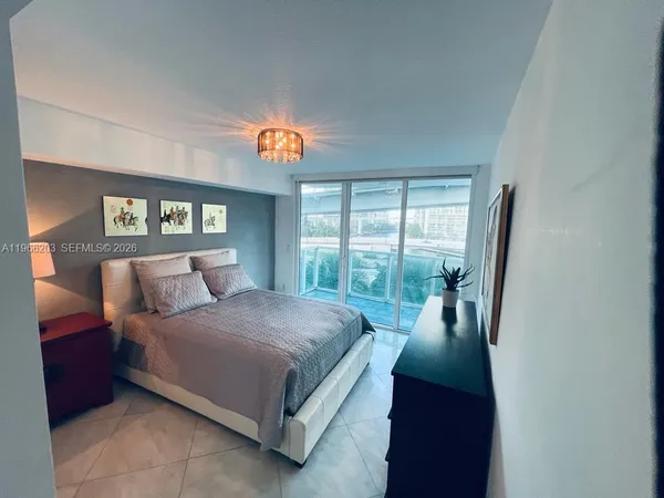 a bathroom with a glass door and shower