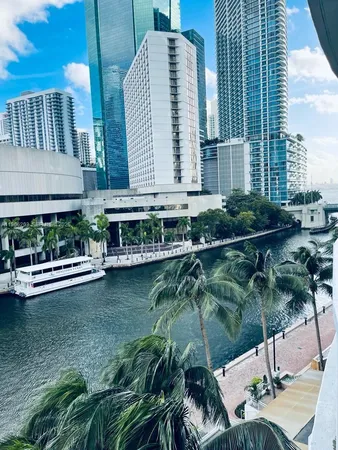 a view of swimming pool with outdoor seating and plants