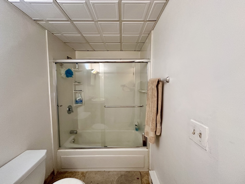46 Cochituate Road, Unit 408 Framingham, MA 01701 - Photo 11 of 20 a bathroom with a shower