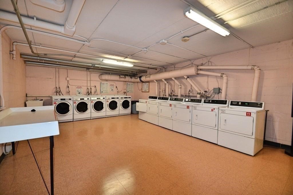 46 Cochituate Road, Unit 408 Framingham, MA 01701 - Photo 18 of 20 a kitchen with cabinets and window