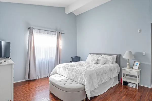 a bedroom with a bed and a chair