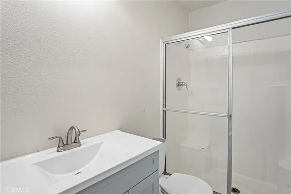 a bathroom with a sink toilet and vanity