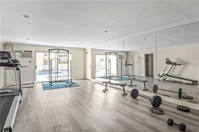 a living room with fireplace furniture and a large window