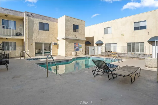a swimming pool with outdoor seating