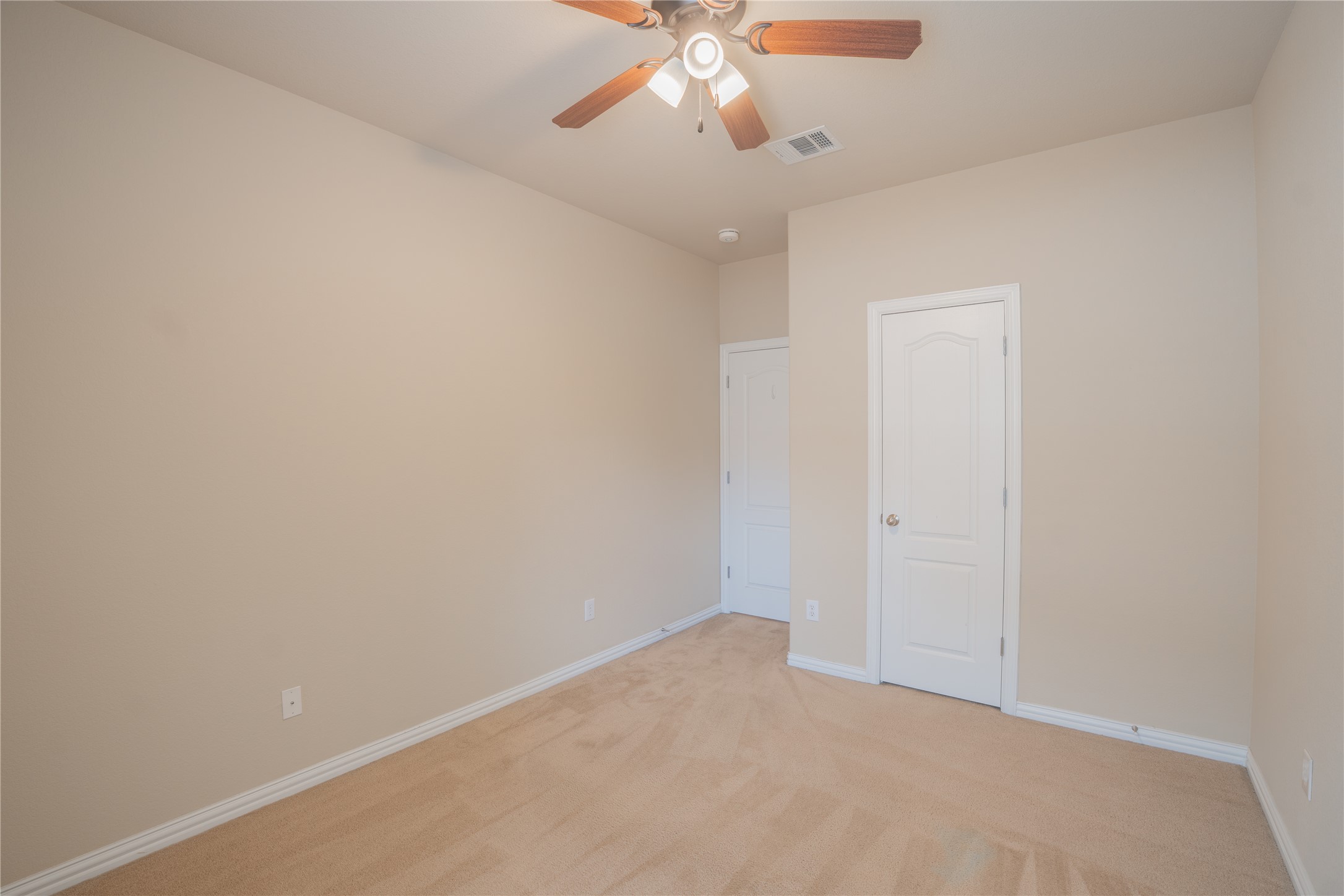 403 Tascate Street Georgetown, TX 78628 - Photo 19 of 26 A spacious room with soft carpeting and ample wall space awaits personalization.