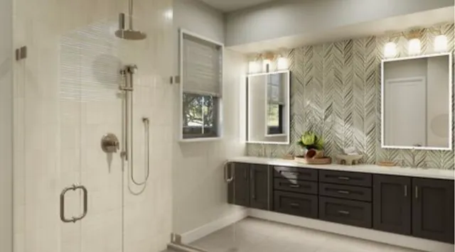 a bathroom with a double vanity sink shower and a mirror