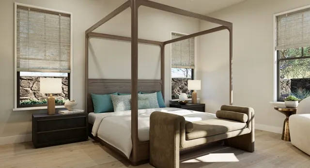 a bedroom with a bed and a mirror