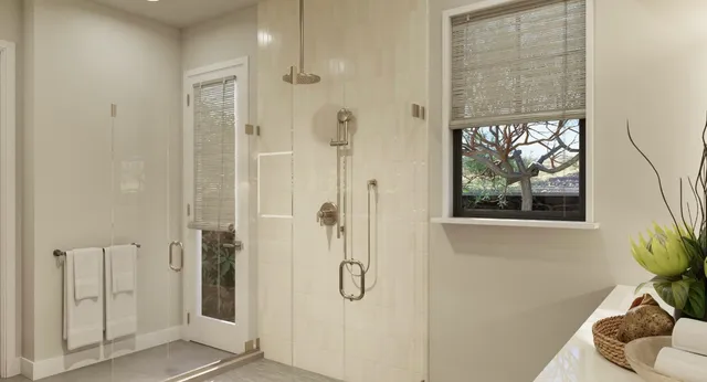 a bathroom with a glass shower door