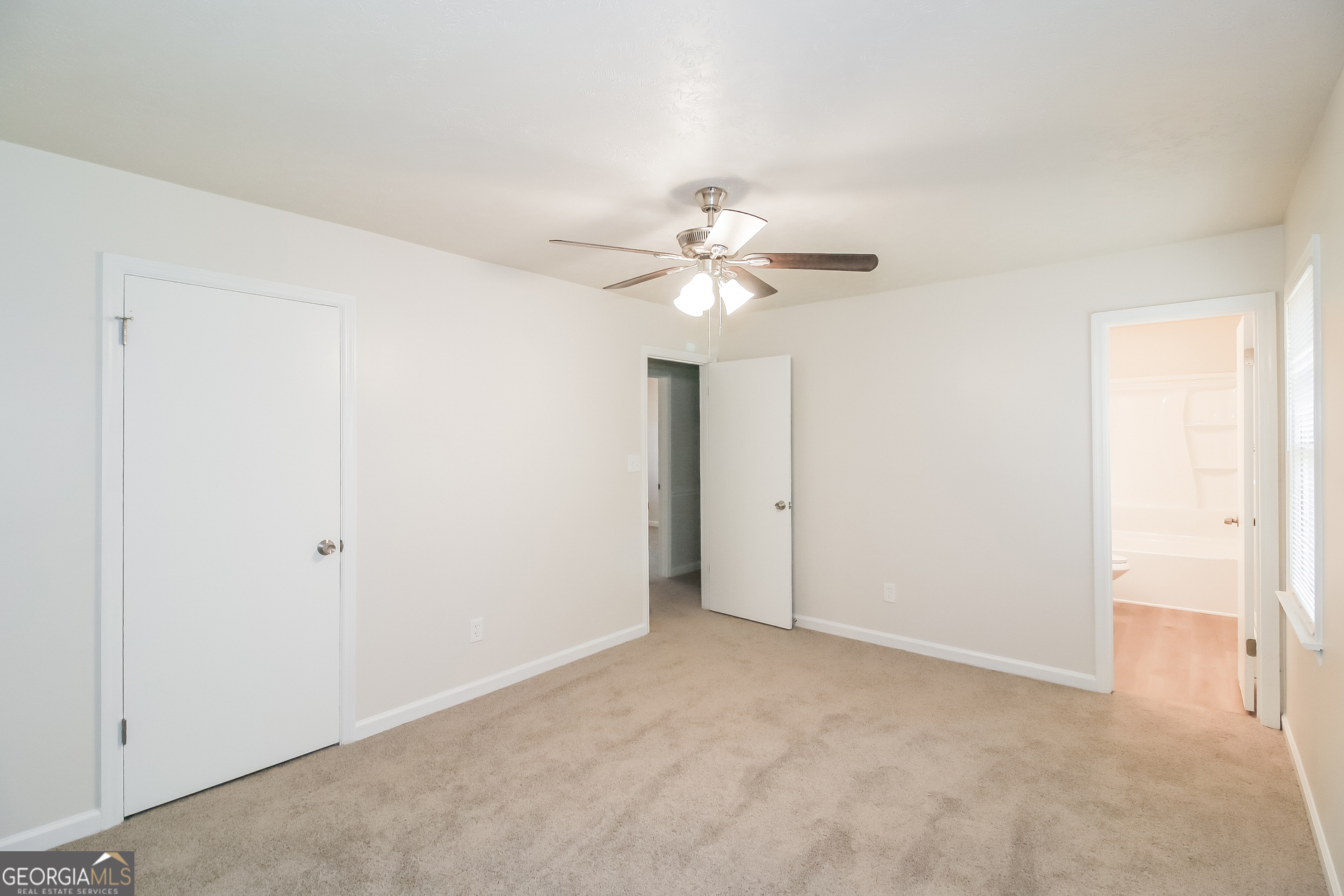 632 Cloudland Drive Stockbridge, GA 30281 - Photo 10 of 18 a view of an empty room with a ceiling fan