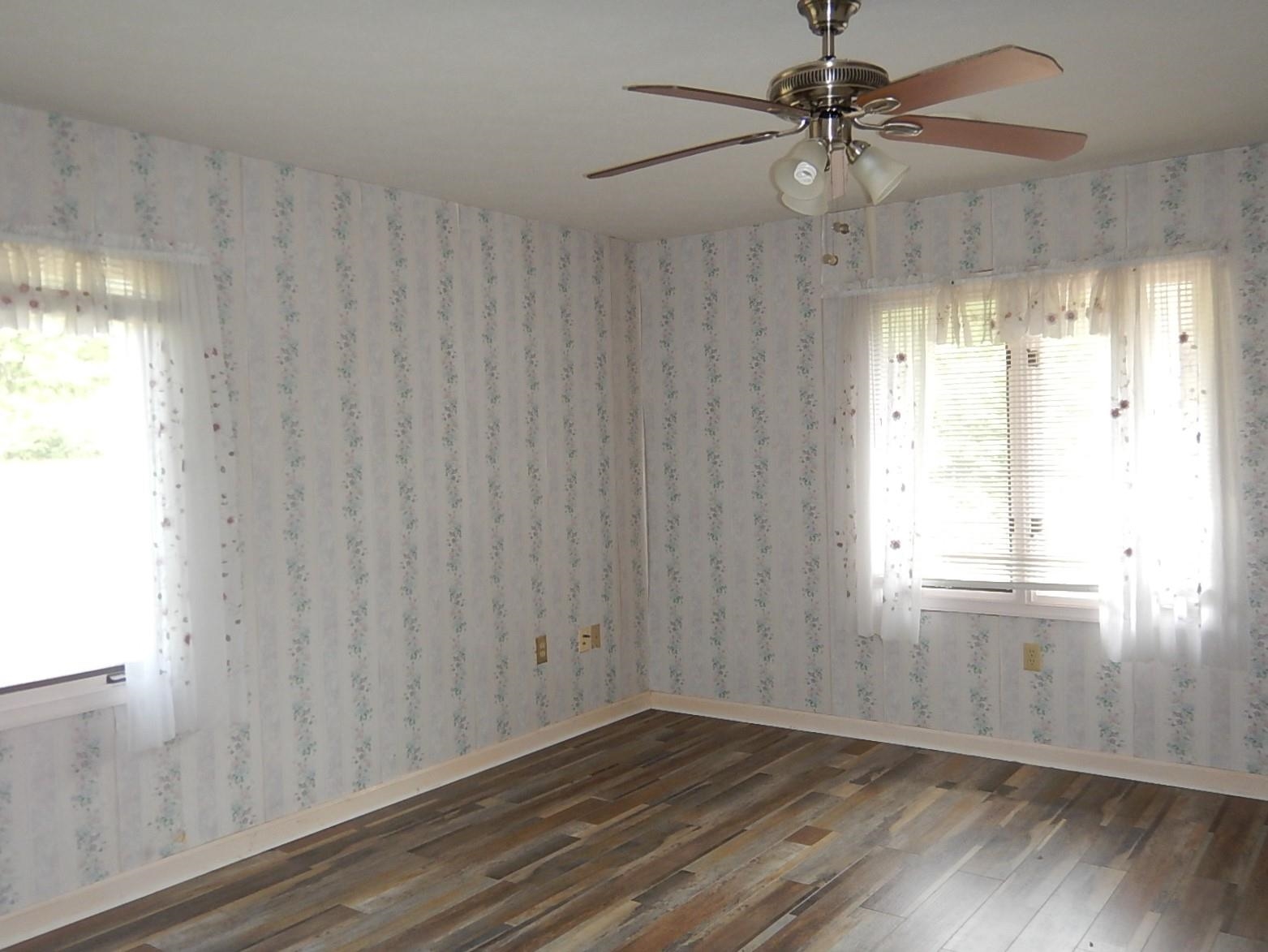 161 Smoky Row Road Staunton, VA 24401 - Photo 16 of 25 a view of an empty room with a window and wooden floor