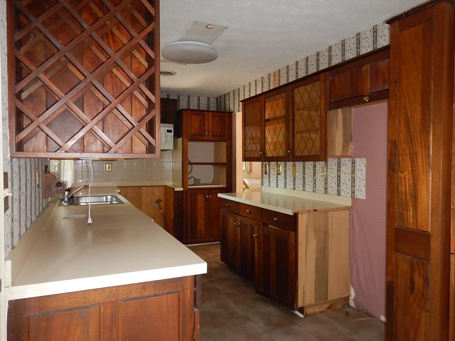 161 Smoky Row Road Staunton, VA 24401 - Photo 9 of 25 a kitchen with a wooden floor and a sink