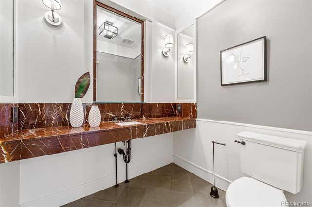 a bathroom with a toilet and a sink