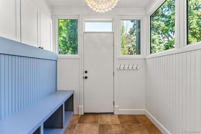 a view of a kitchen with wooden floor and windows