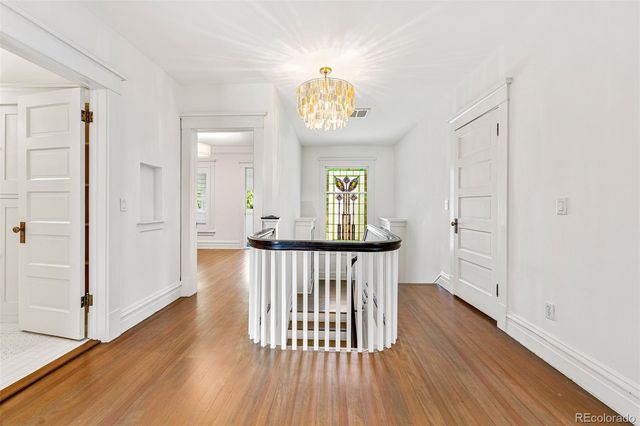 a view of entryway with wooden floor