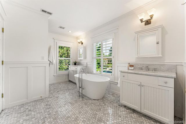 a bathroom with a sink toilet and tub