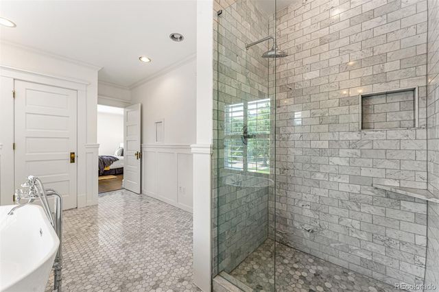 a bathroom with a bathtub and shower