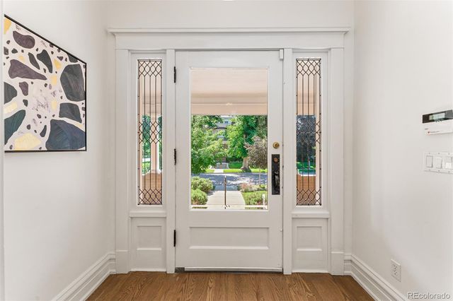 a view of front door with wooden floor