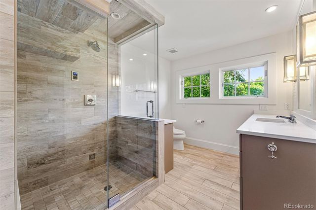a bathroom with a shower and a sink