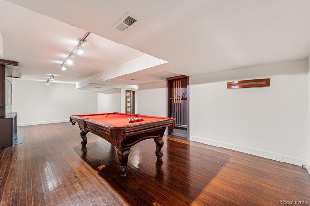 a room with furniture and wooden floor