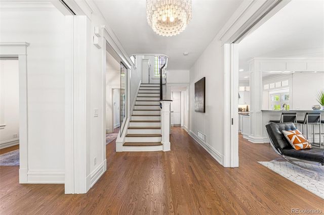 a view of a hallway view with wooden floor and windows