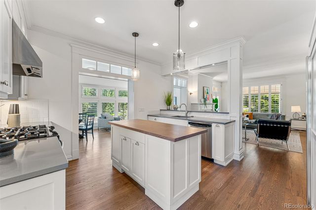 a kitchen with counter space and a wooden floor