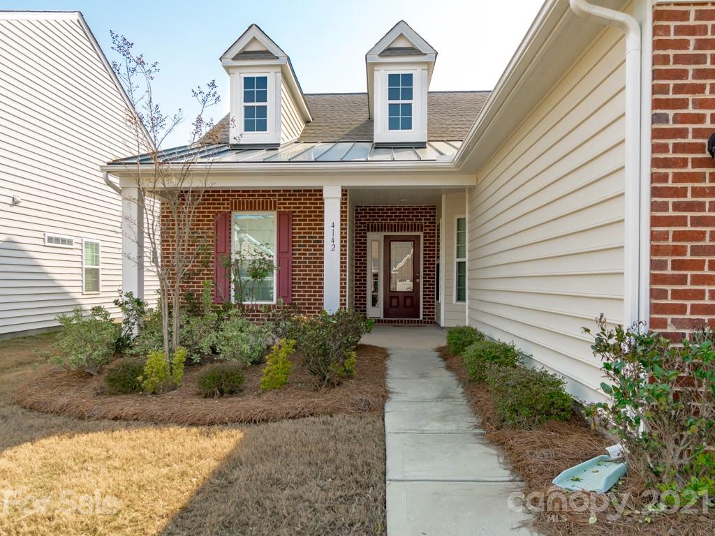 4142 Perth Road Indian Land, SC 29707 - Photo 2 of 26 a front view of a house with garden