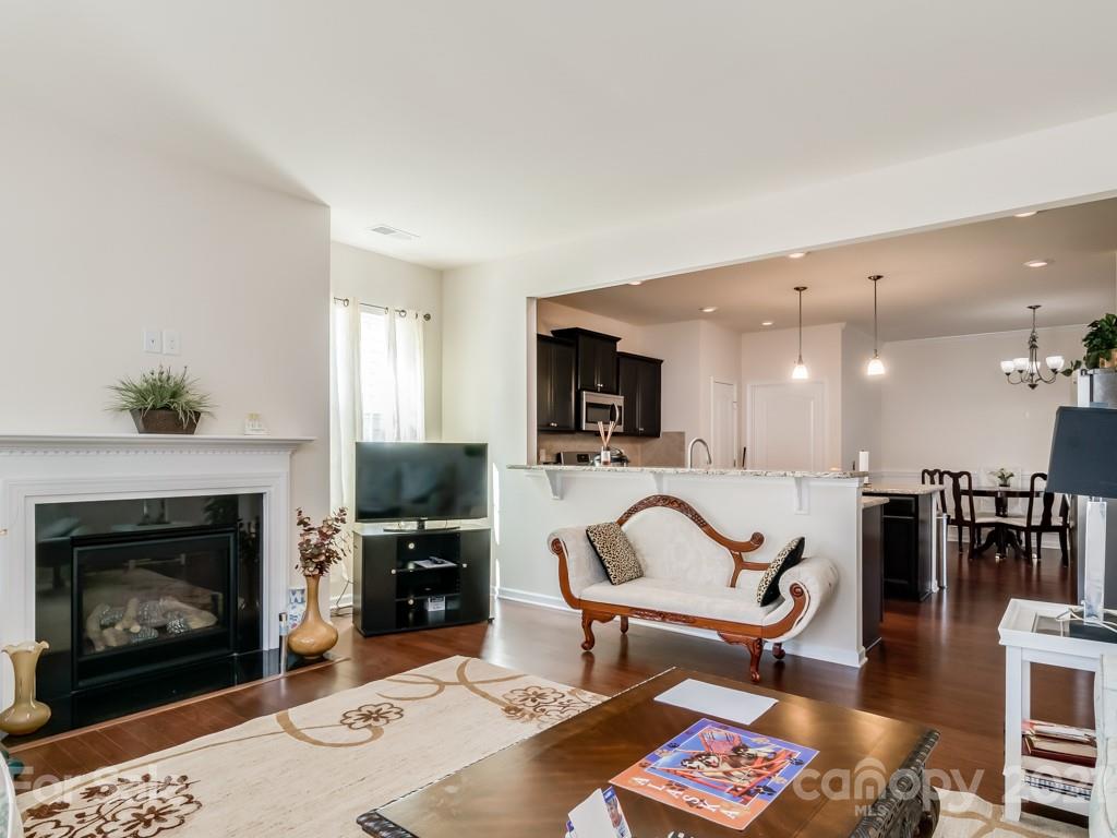 4142 Perth Road Indian Land, SC 29707 - Photo 13 of 26 a living room with furniture and a fireplace