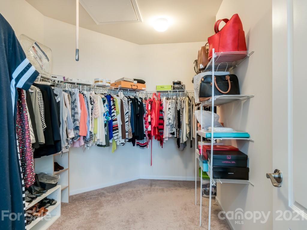 4142 Perth Road Indian Land, SC 29707 - Photo 17 of 26 a view of walk in closet with clothes and shoes