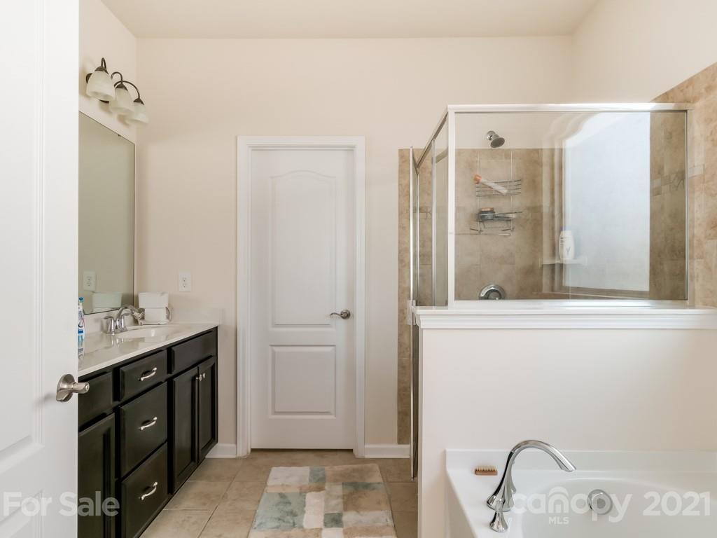 4142 Perth Road Indian Land, SC 29707 - Photo 19 of 26 a bathroom with a tub sink and mirror