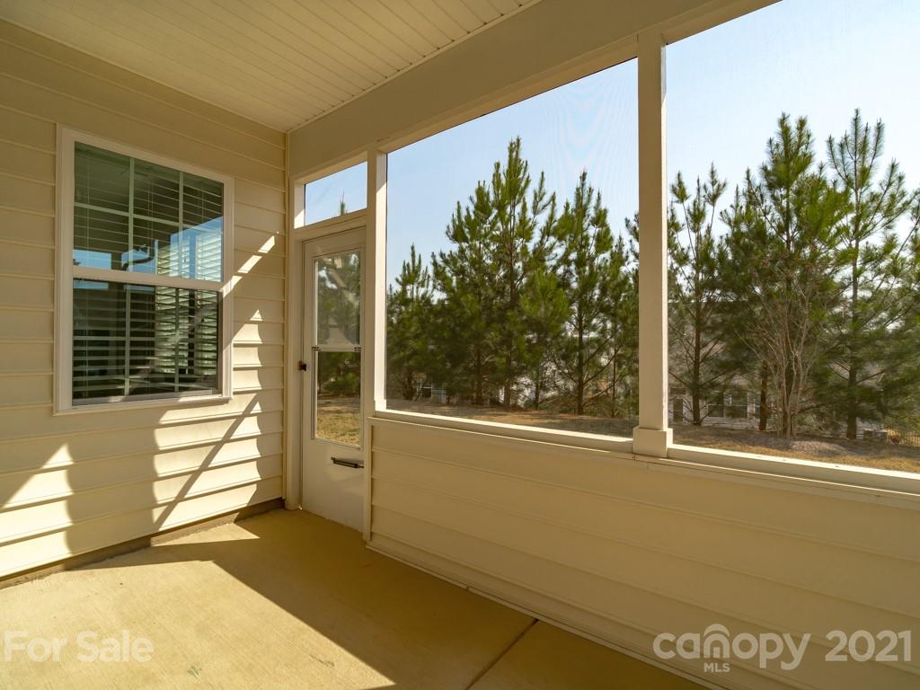 4142 Perth Road Indian Land, SC 29707 - Photo 24 of 26 a view of a glass door with a floor to ceiling window next to a yard