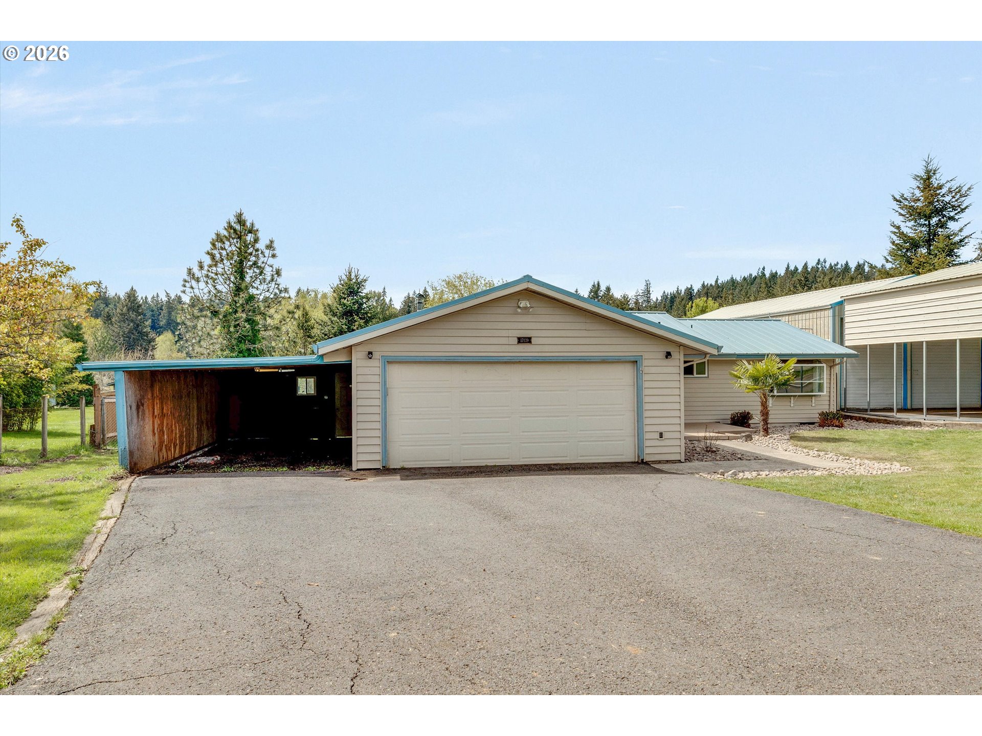 17139 South Bradley Road Oregon City, OR 97045 - Photo 2 of 47 a view of a house with a yard and garage