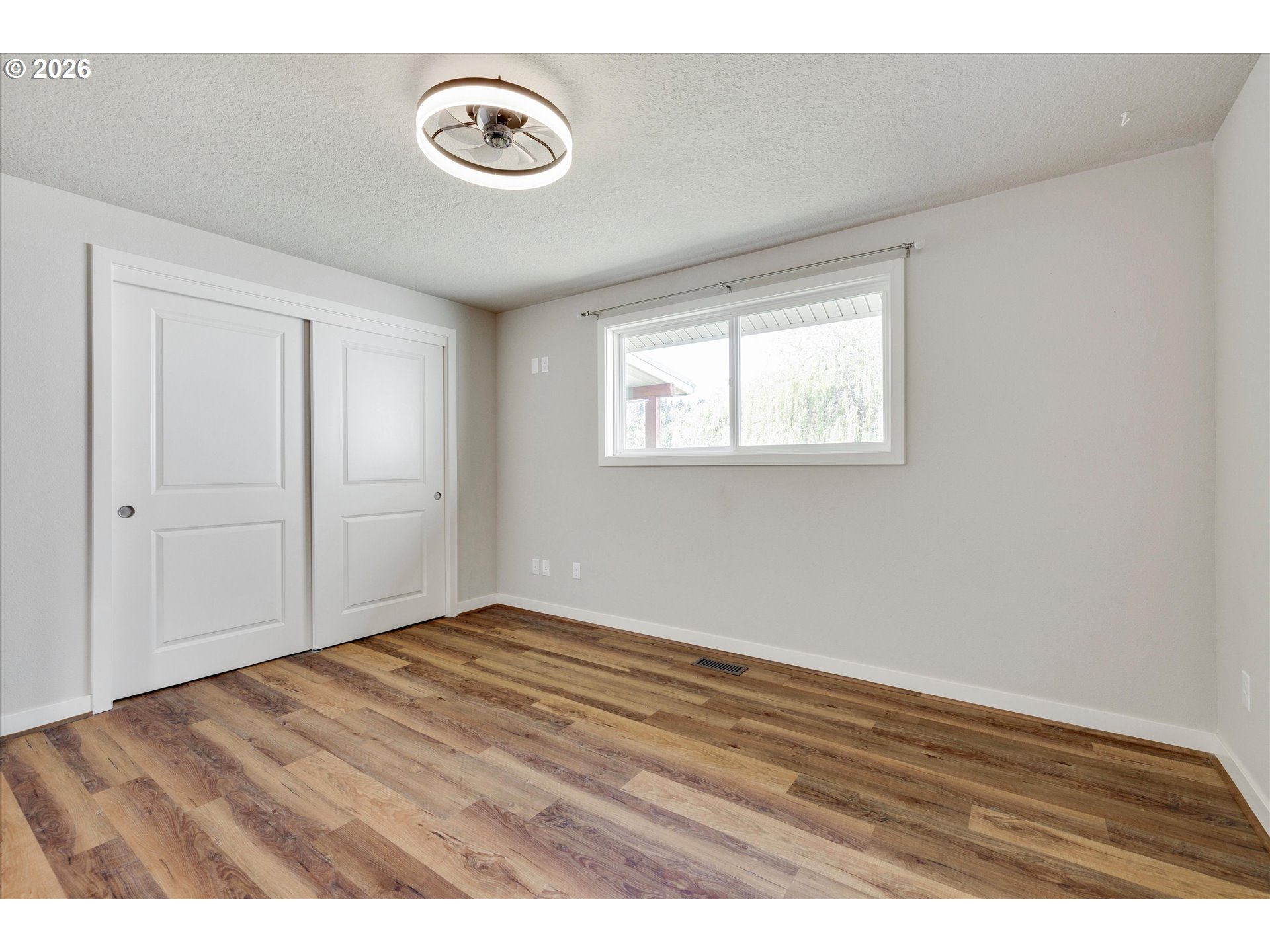 17139 South Bradley Road Oregon City, OR 97045 - Photo 24 of 47 a view of an empty room with wooden floor
