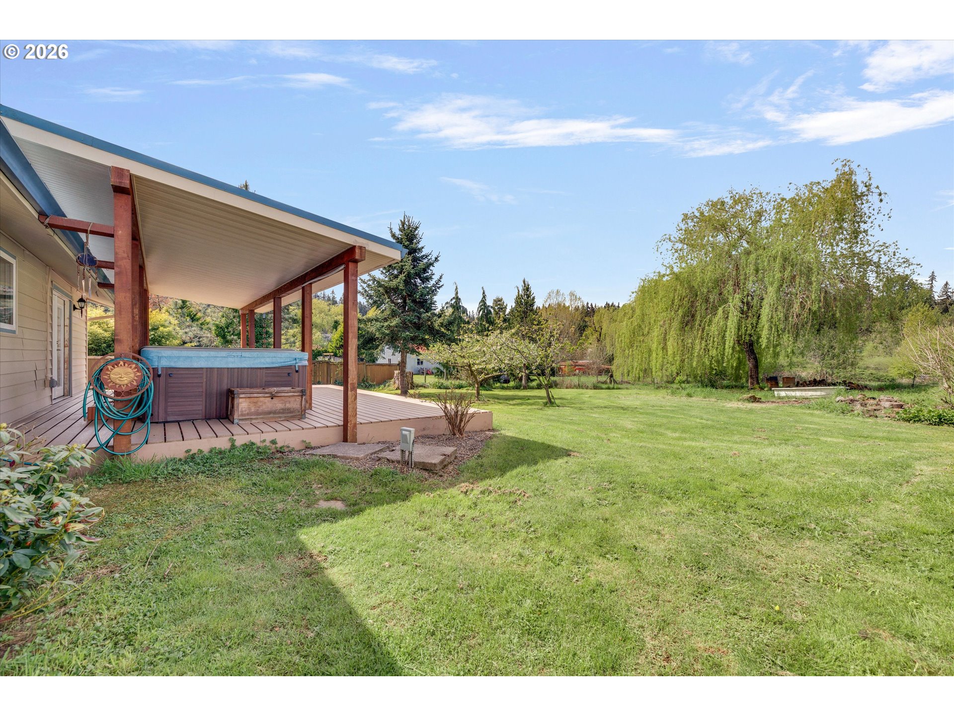 17139 South Bradley Road Oregon City, OR 97045 - Photo 28 of 47 a backyard of a house with table and chairs