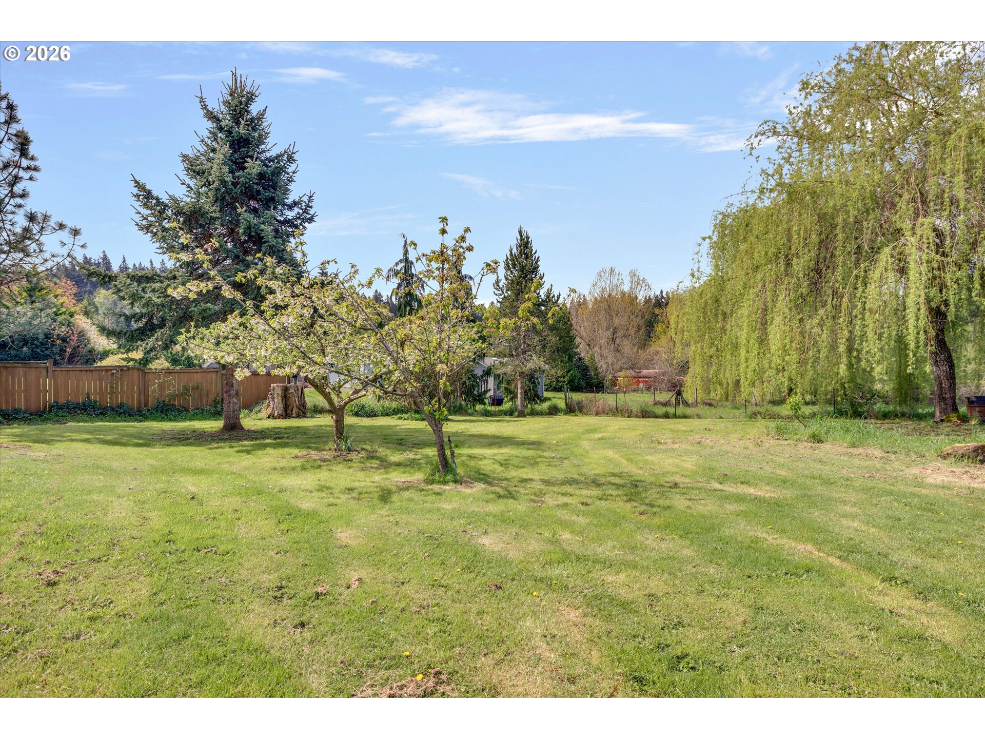 17139 South Bradley Road Oregon City, OR 97045 - Photo 32 of 47 a backyard of a house with lots of green space