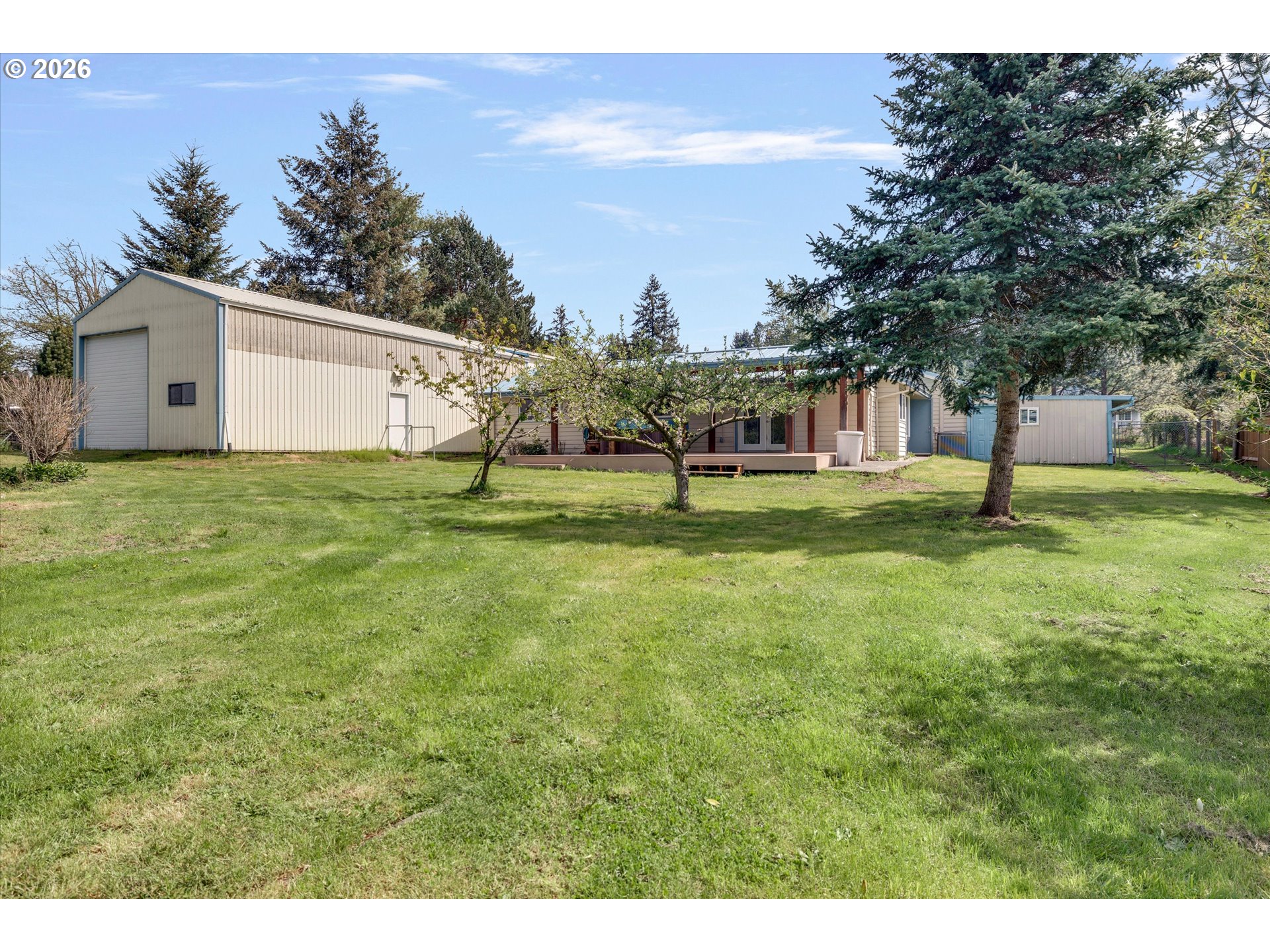 17139 South Bradley Road Oregon City, OR 97045 - Photo 33 of 47 a backyard of a house with lots of green space and fountain