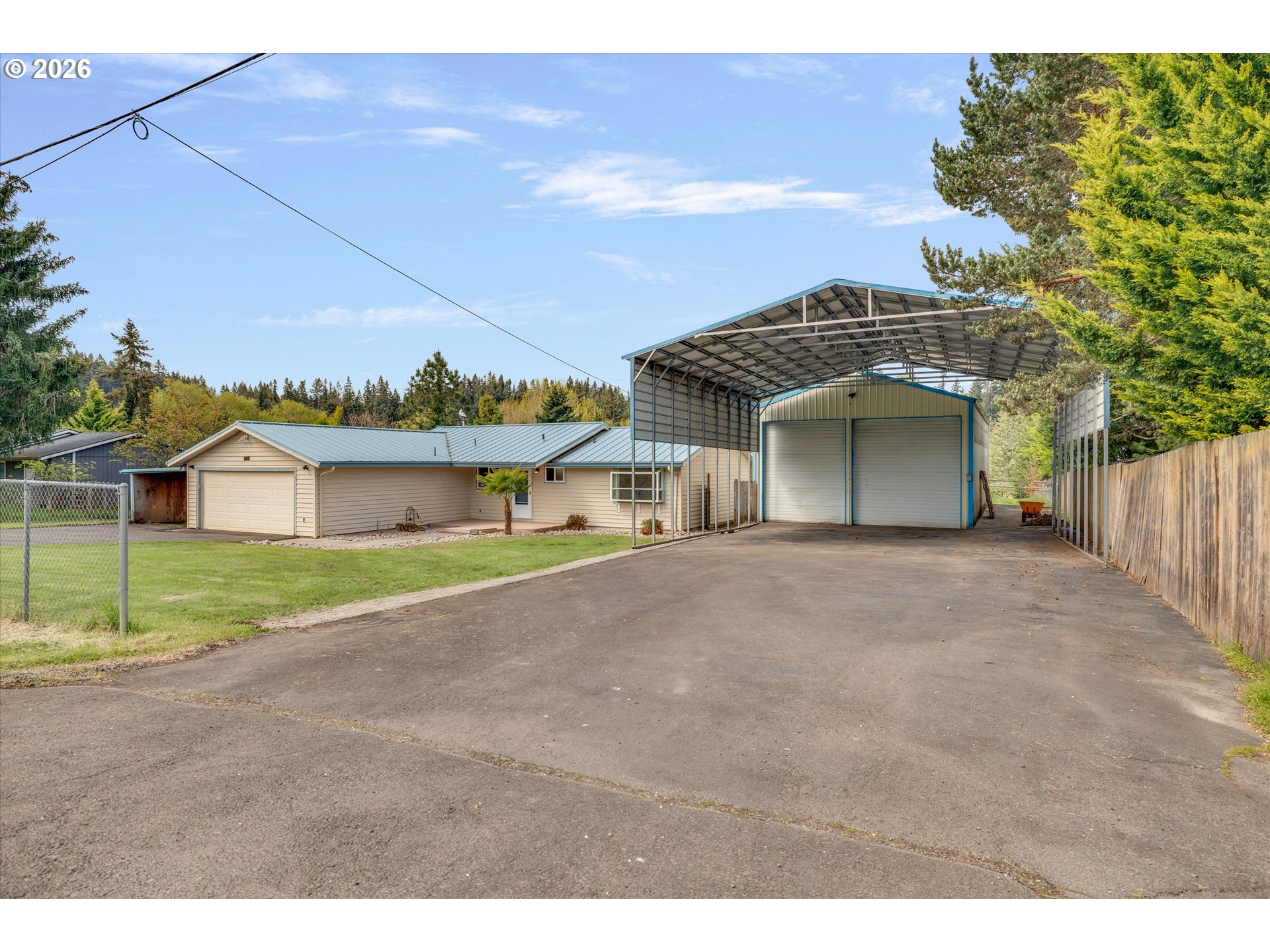 17139 South Bradley Road Oregon City, OR 97045 - Photo 38 of 47 a front view of a house with a yard and garage