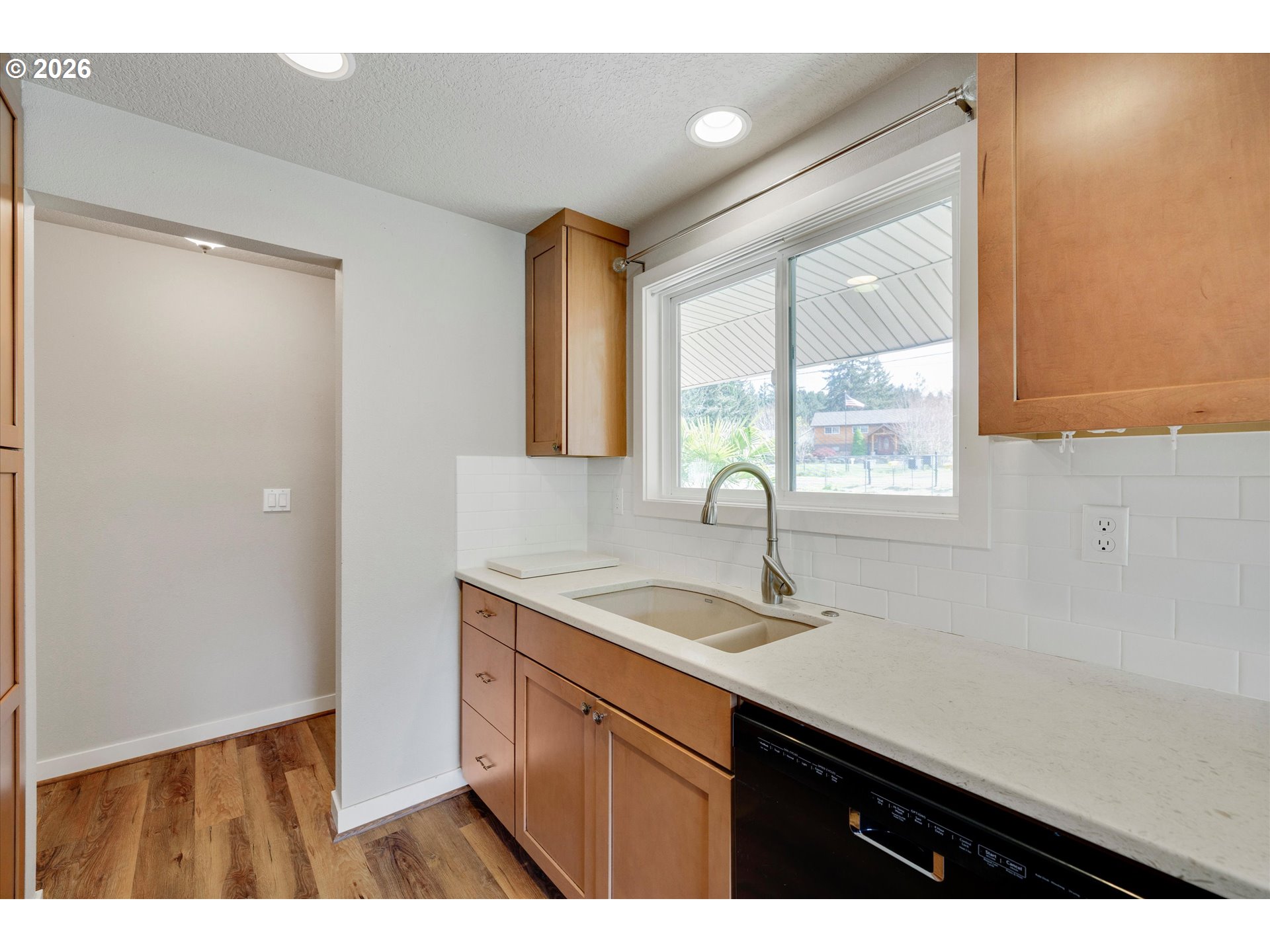 17139 South Bradley Road Oregon City, OR 97045 - Photo 5 of 47 a kitchen with a sink cabinets and a window
