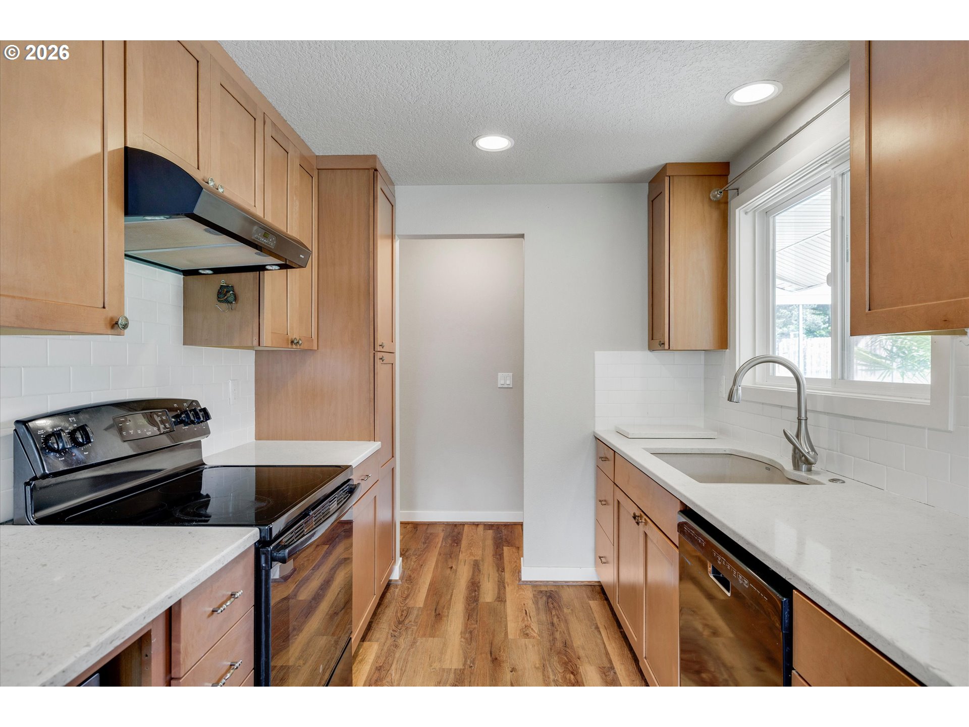 17139 South Bradley Road Oregon City, OR 97045 - Photo 8 of 47 a kitchen that has a sink and a stove
