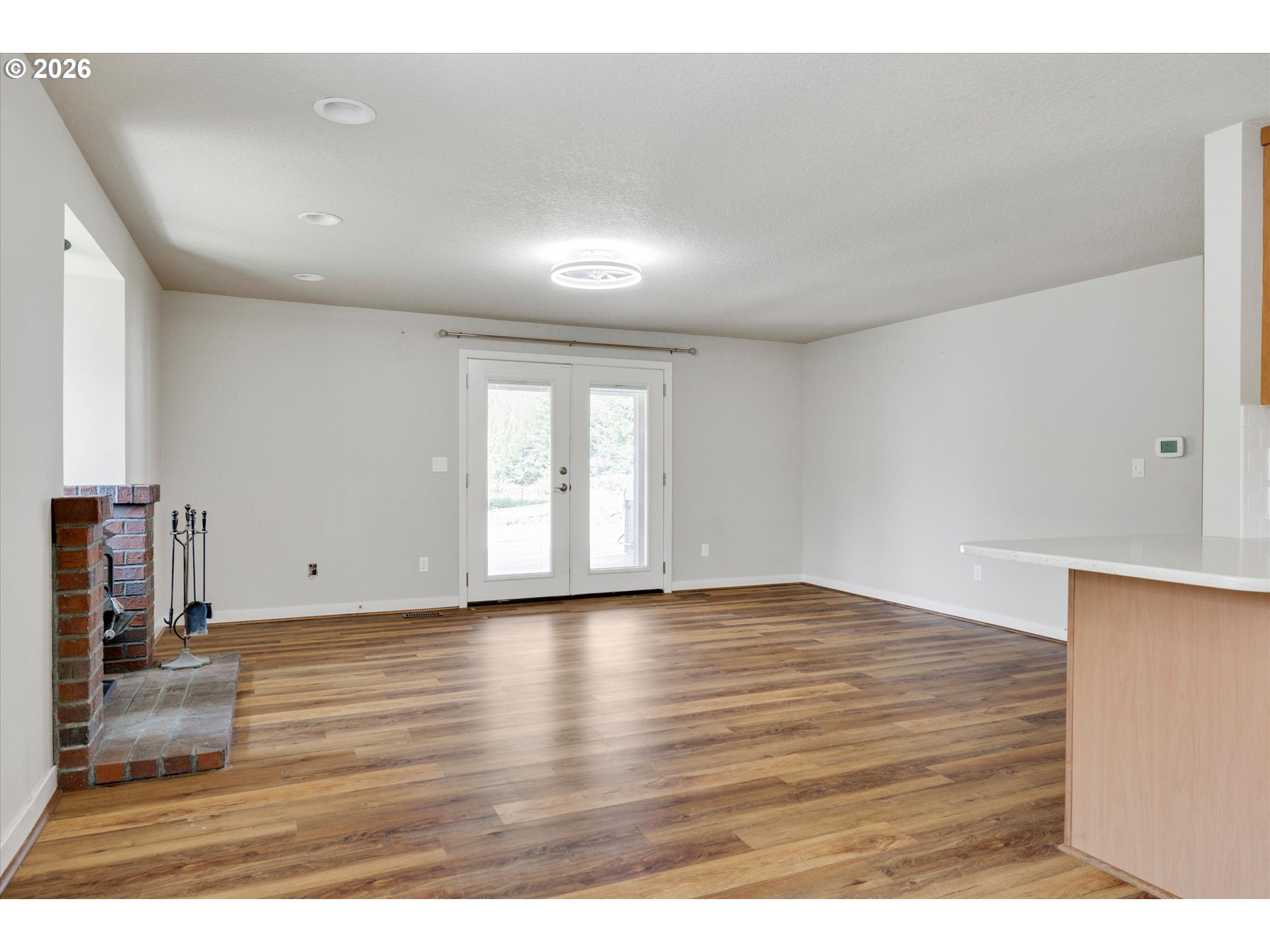 17139 South Bradley Road Oregon City, OR 97045 - Photo 10 of 47 a view of an empty room with wooden floor