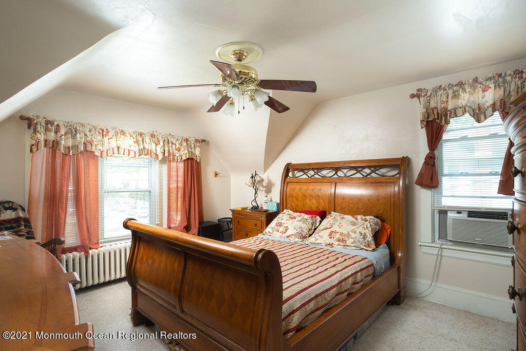 48 Ridgway Street Mount Holly, NJ 08060 - Photo 11 of 24 a bedroom with a bed and window