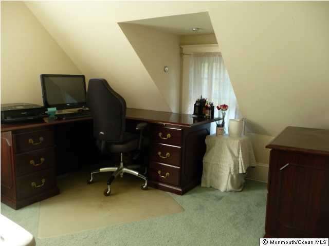 48 Ridgway Street Mount Holly, NJ 08060 - Photo 17 of 24 a view of a workspace with furniture and a gate