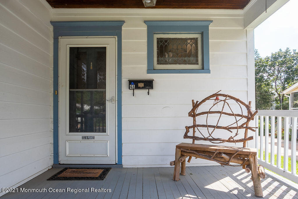 48 Ridgway Street Mount Holly, NJ 08060 - Photo 3 of 24 a view of a bench in the balcony